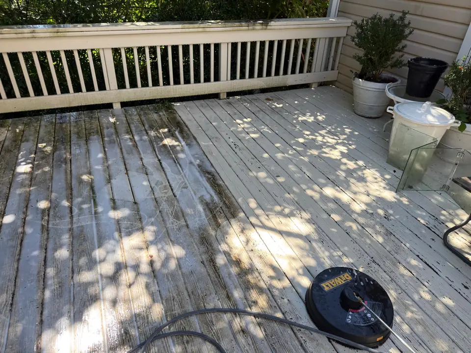 Deck surface during cleaning, with the surface-cleaning attachment visible