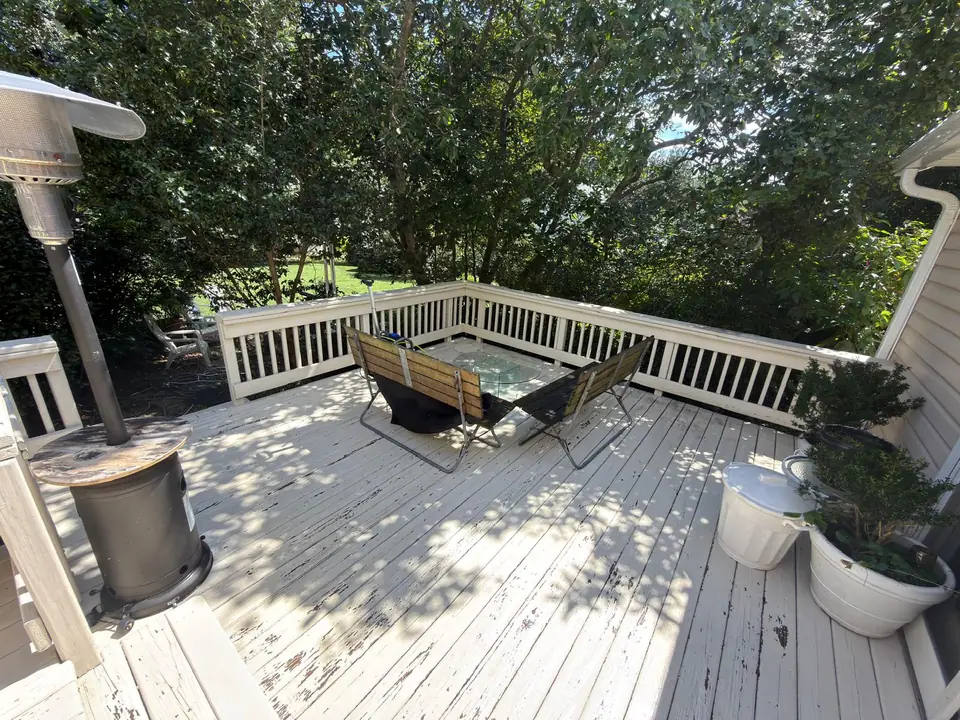 Outdoor deck and railings around a patio seating area