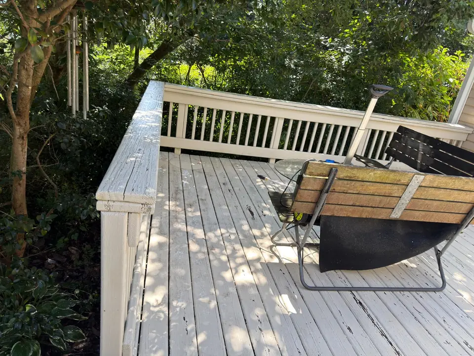 Deck boards and railing around the outdoor seating area