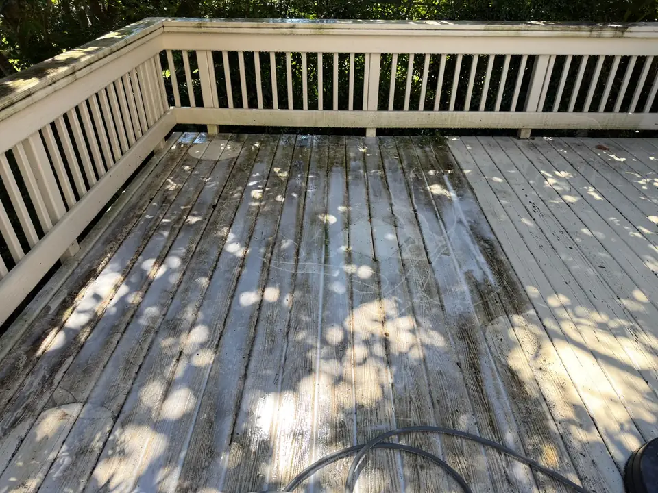 Wood deck boards during surface cleaning