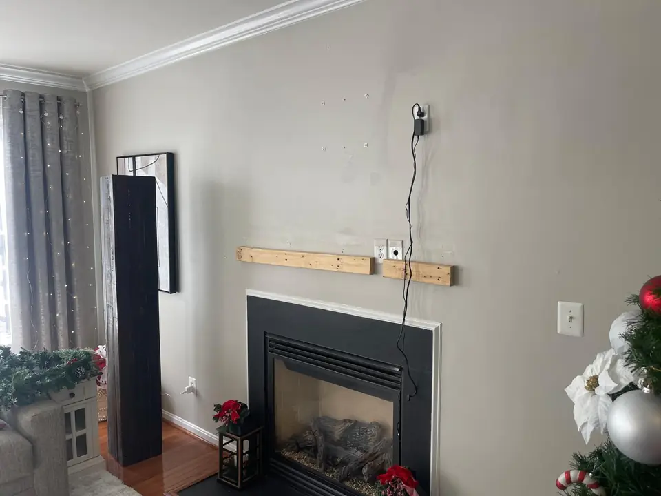 Wood mounting supports prepared above the fireplace before the mantel is fitted