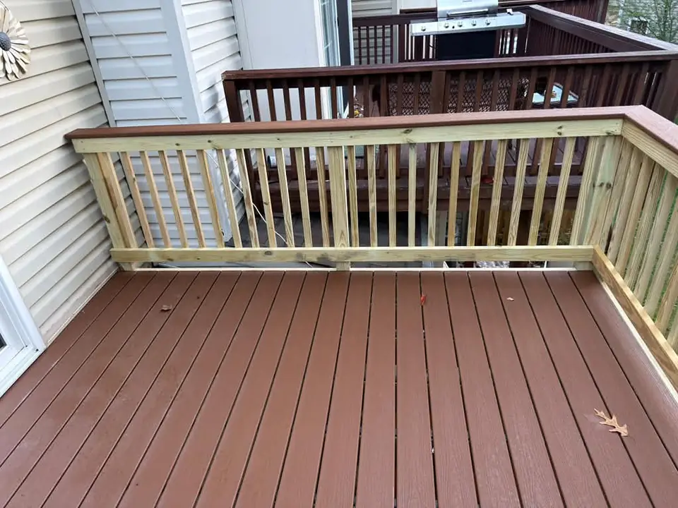 Close view of wood balusters and brown deck boards