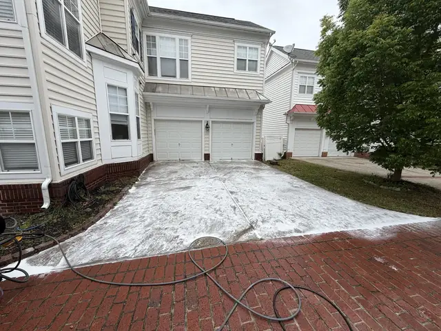 Pressure washing a brick patio and concrete walkway