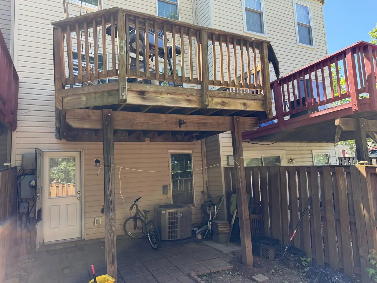 Original weathered deck, railings and support posts before the rebuild