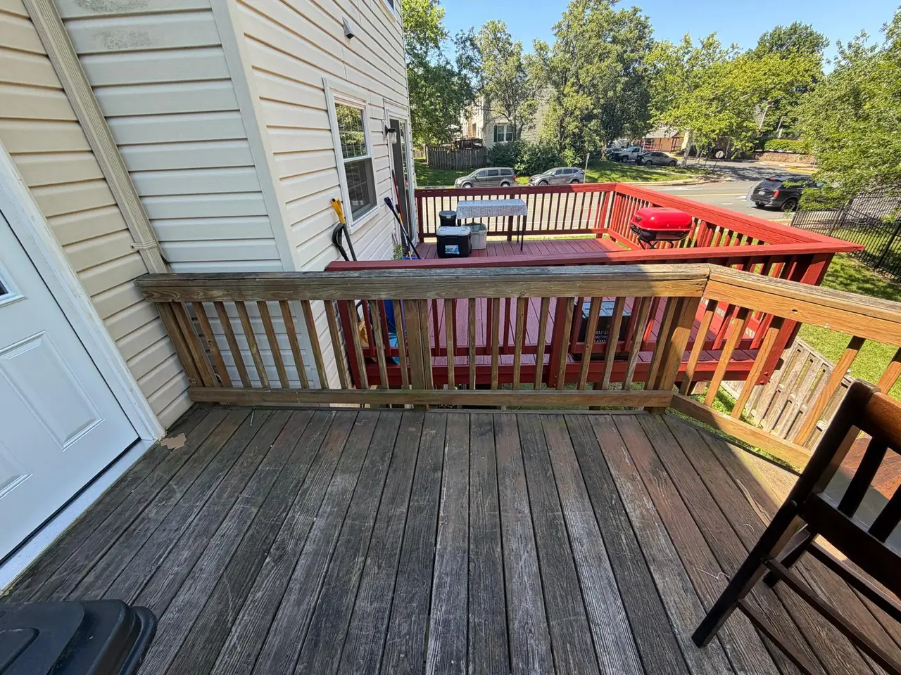 Weathered deck surface and railing before the rebuild