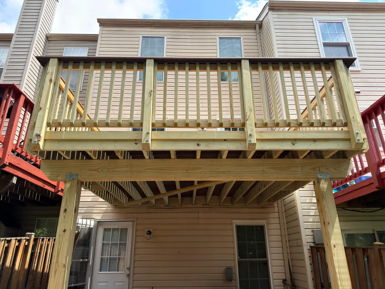 Wide front view of the new deck railings and support beam