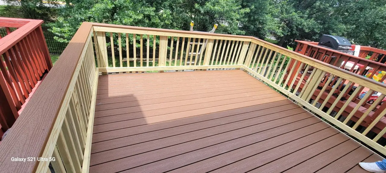 Finished brown deck boards and wood railings viewed from above