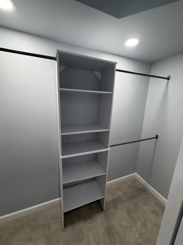 Closet with built-in shelving and hanging rods