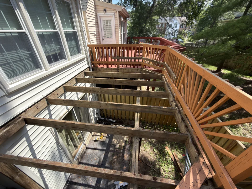 Exposed deck joists during removal of the old deck boards