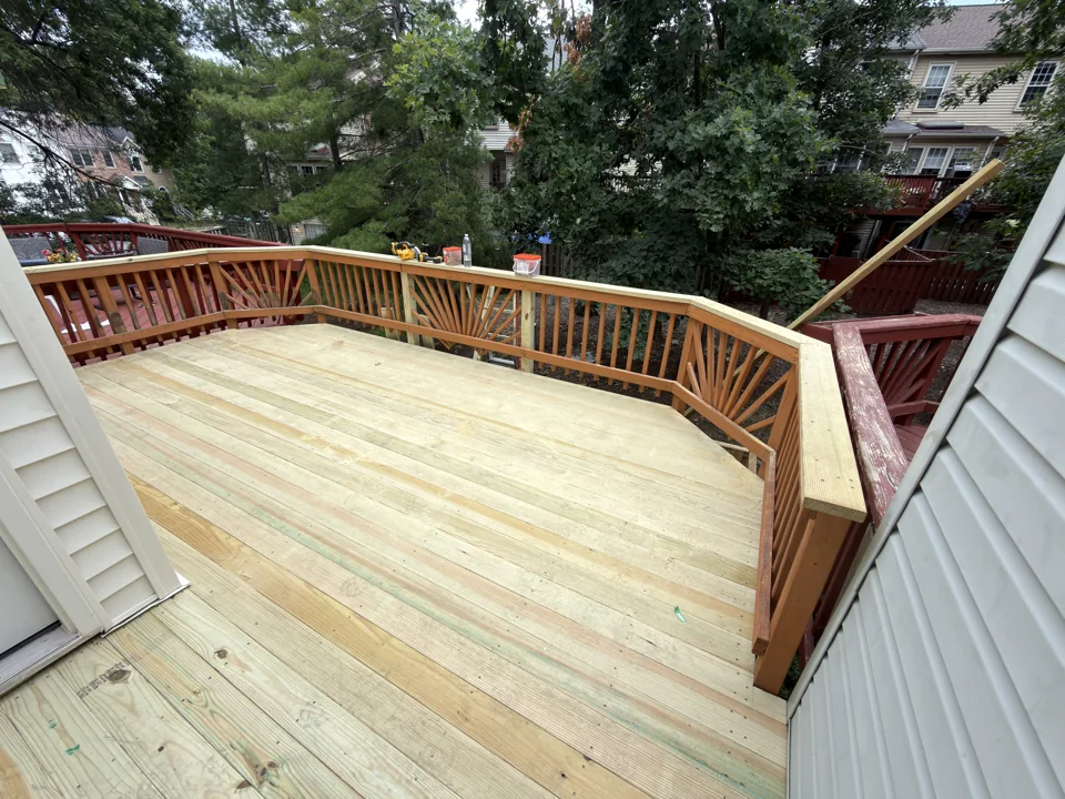 New wood decking with decorative wood railing at a NobleHouse project