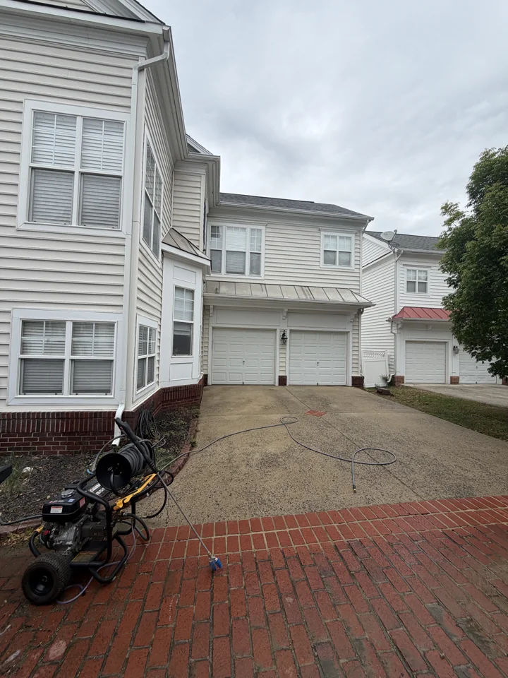 Driveway cleaning project with pressure-washing equipment